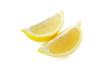 Pieces of ripe lemon on white background