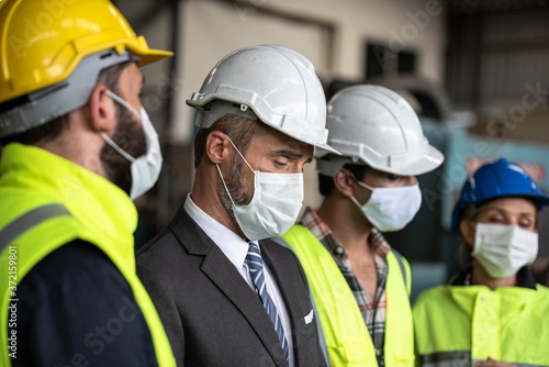 Cuadros en Lienzo Industrial Manager and Technician, Engineer workers with hardhats, vest discussing Business Management in industry manufacturing Factory
