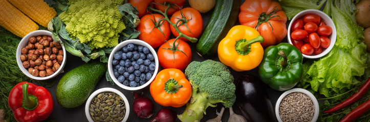 healthy eating ingredients: fresh vegetables, fruits and superfood. nutrition, diet, vegan food conc