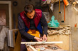 © Angelov - handsome joiner work in carpentry. He is successful entrepreneur at his workplace.