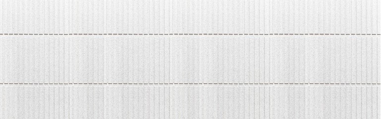 Panorama of Modern white stone wall with stripes texture and seamless background