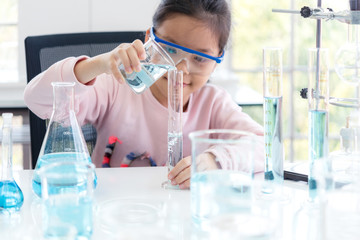 Wall Mural - asian children analyzing study evaluating microscope with scientist. health care researchers doing s
