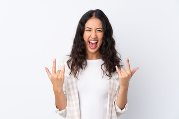 Wall Mural - Mixed race woman over isolated white background making rock gesture