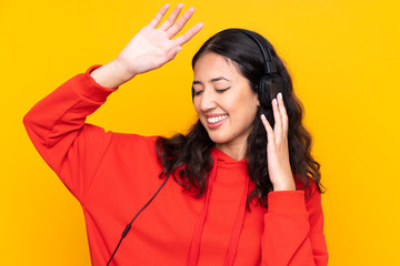 Sticker - Mixed race woman wearing a red sweatshirt listening music and dancing