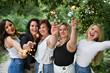 © Louis-Paul Photo - Group of girls friends having good time together with bengal lights