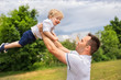 © Louis-Photo - father and his cute baby boy having fun outdoors