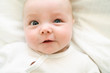 © Louis-Paul Photo - cute two month old baby in bed at home