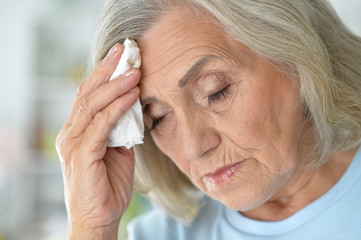 Poster - Close up portrait of sad ill senior woman