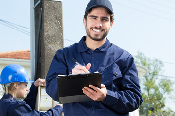 electrician engineer technician reading the electricity counter