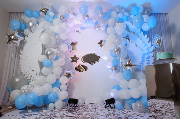 Wall Mural - Blue photo zone with balloons, wings and cake on birthday party