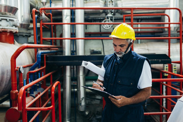 Wall Mural - middle aged industry worker working indoor