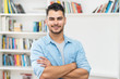 © Daniel Ernst - Laughing hispanic hipster man with beard and casual clothes