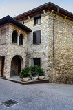 Fototapeta Uliczki - The narrow ancient streets and architecture of the city of Sirmione. Lake Garda, Northern Italy