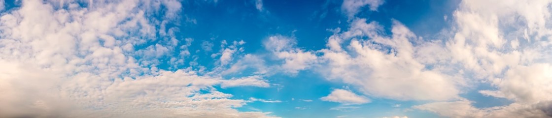 Wall Mural - Panorama of a beautiful blue summer sky with fluffy clouds