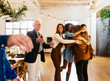 © Bonninstudio/Stocksy - Father and daughter greeting family and friends