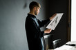 © Javier D√≠ez/Stocksy - Male designer examining sketch in office