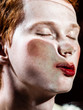 © Sergey Filimonov/Stocksy - Androgynous man pressing face to camera