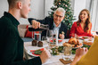 © Studio Firma/Stocksy - Christmas Lunch with Family