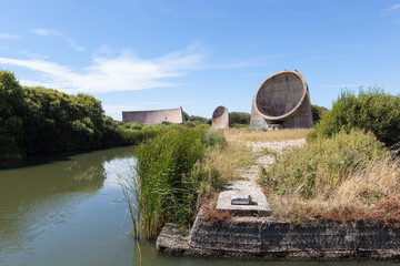 Rare sound mirrors or listening ears. Concrete structures designed to pick up engines of enemy aircraft coming from the channel. Built 1924 on Romney Marsh, UK.