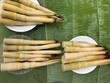 Pickled bamboo shoots placed on banana leaves, Bambusa vulgaris