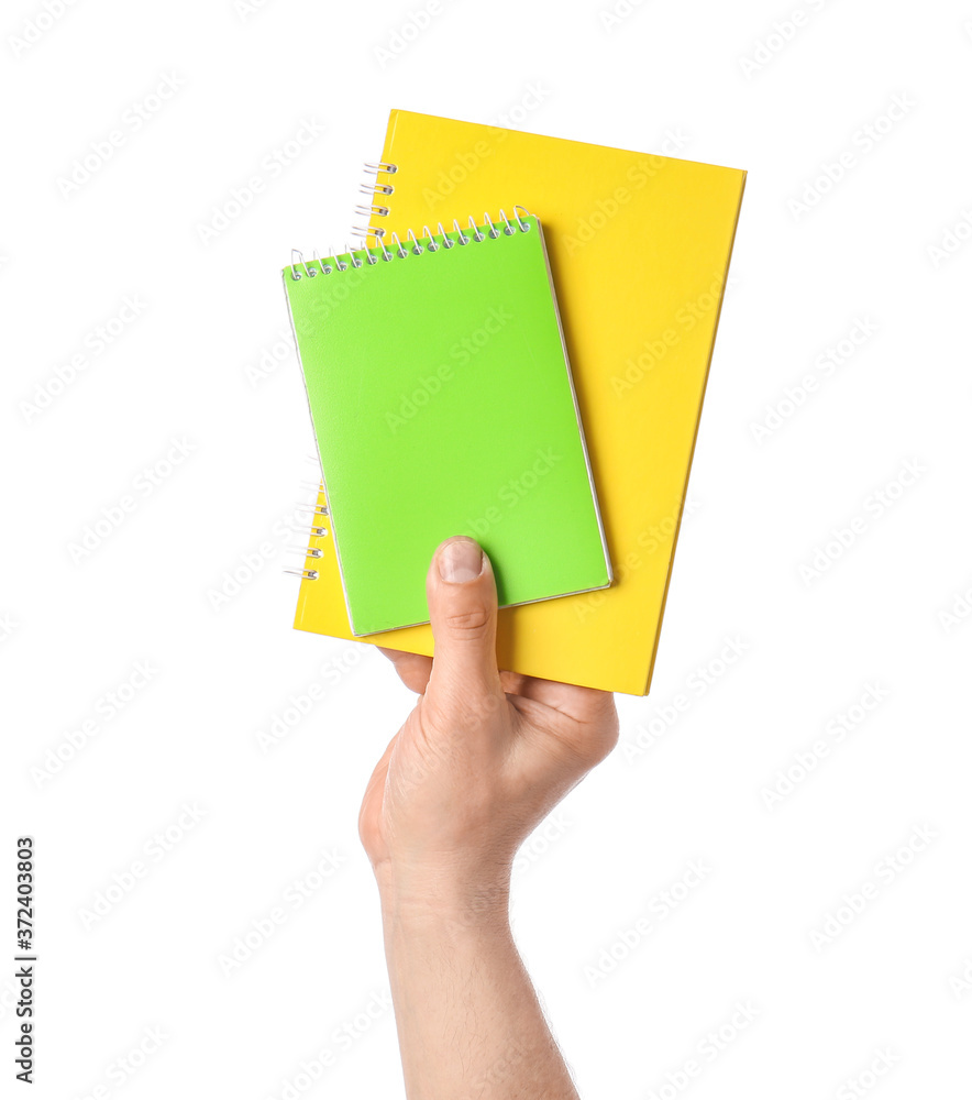 Male hand with notebooks on white background