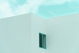 Fototapeta  - white concrete minimalism architecture building with blue sky background