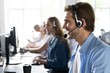 © opolja - Young handsome male customer support phone operator with headset working in call center.