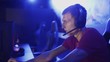 © stanis88 - Close-up on the Hands of the Girl Gamer Playing in the Video Game Using Keyboard. Female Hacker Breaks into System. Background with Cool Neon Lights.
