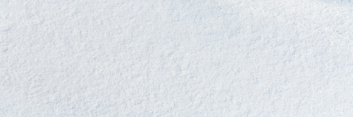 Wall Mural - Natural snow texture. Smooth surface of clean fresh snow. Snowy ground. Winter background with snow patterns. Perfect for Christmas and New Year design. Closeup top view.