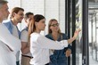 © opolja - Business people meeting at office and use post it notes to share idea. Brainstorming concept. Sticky note on glass wall.