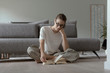 © stokkete - Woman relaxing at home and reading a book