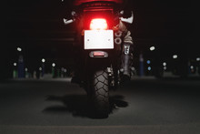 Motor Biker On The Motorbike On The Night Parking Close Up.