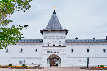 The Tobolsk Kremlin is white-stone kremlin in Siberia, Russia.Wall and tower. Russian inscription above the gate - shopping arcade