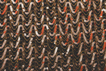 Golden, Black And Orange Sequins And Beads Background