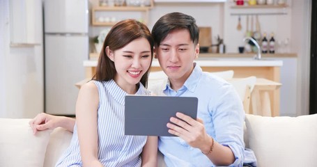 Sticker - couple use tablet at home