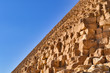 The golden sandstone of the Great Pyramid of Giza, Egypt, and the blue sky