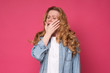 © Viktor Koldunov - Yawning exhausted mature woman holding her hand in front of her mouth. I need a rest. Studio shot