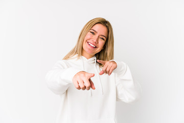 Poster - Young blonde caucasian woman isolated pointing to front with fingers.