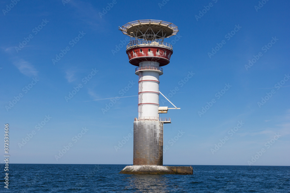 Irbe lighthouse in Baltic sea. Built in 1979 in Mihaila Michaels bank ...