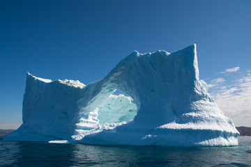 Wall Mural - big white-blue iceberg with arch