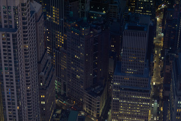 Sticker - Looking down from a skyscraper to Manhattan buildings and streets in financial district of Manhattan in New York City at night