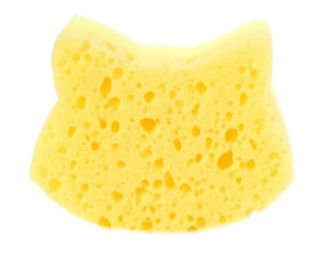 Wall Mural - Yellow baby washcloth in the shape of a cat for bathing in the bath or shower.