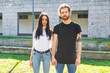© © Eugenio Marongiu/Westend61 - Young couple holding hands while standing against building