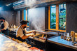 © Oscar Carrascosa Martinez/Westend61 - Chefs wearing protective face masks preparing a dish in restaurant kitchen