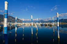 Italy, Lombardy, Clusane, Mooring Posts On Lake Iseo