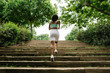 © Xavier Lorenzo/Westend61 - Rear view of female jogger on steps