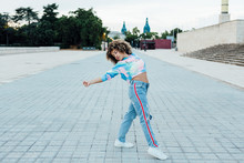 Young Woman Dancing On Square