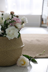 Canvas Print - Bouquet of beautiful peony flowers in basket on floor