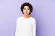 © Asier - African american little boy isolated blows cheeks, has tired expression. Facial expression concept.