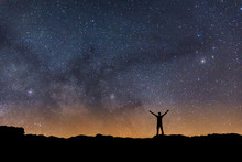 Man Observing The Night Sky With The Milky Way In The Background While You Have Open Arms